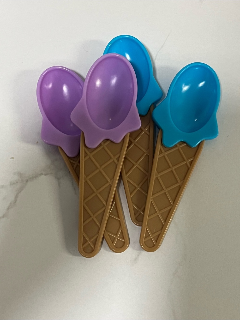 Set of four ice cream shaped spoons